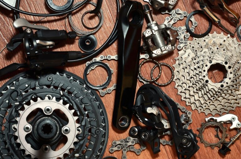 Many different metal parts and components of the running gear of a sports bike